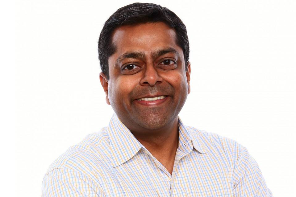 Reltio founder Manish Sood standing against a white background
