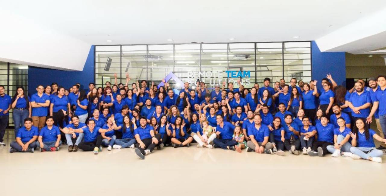 RTS colleagues in blue shirts gathered for a group photograph at the company’s offices