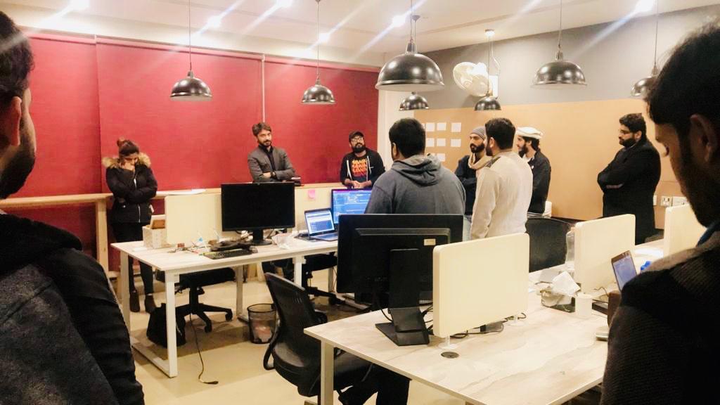 The early Remotebase team gathered in a Lahore office
