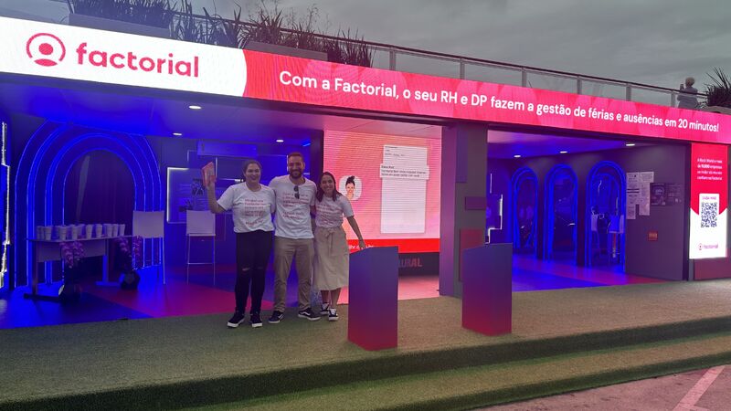 Renan Conde with two colleagues at a Factorial installation during the Rock in Rio visit