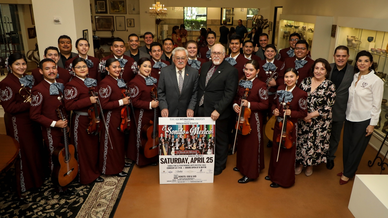 Renato Ramirez with TAMIU administrators and mariachi musicians at a 2020 reception