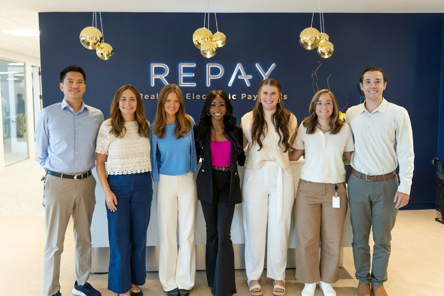 REPAY associate client success managers gathered in the Atlanta office