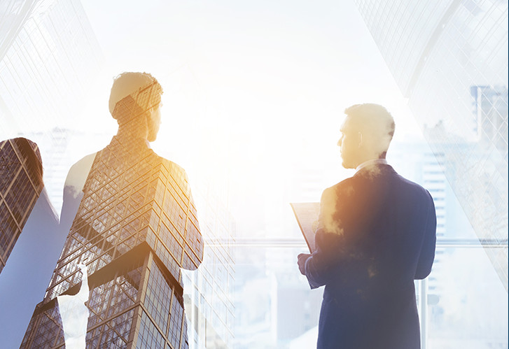 Company website marketing image layering two businesspeople with glass office towers