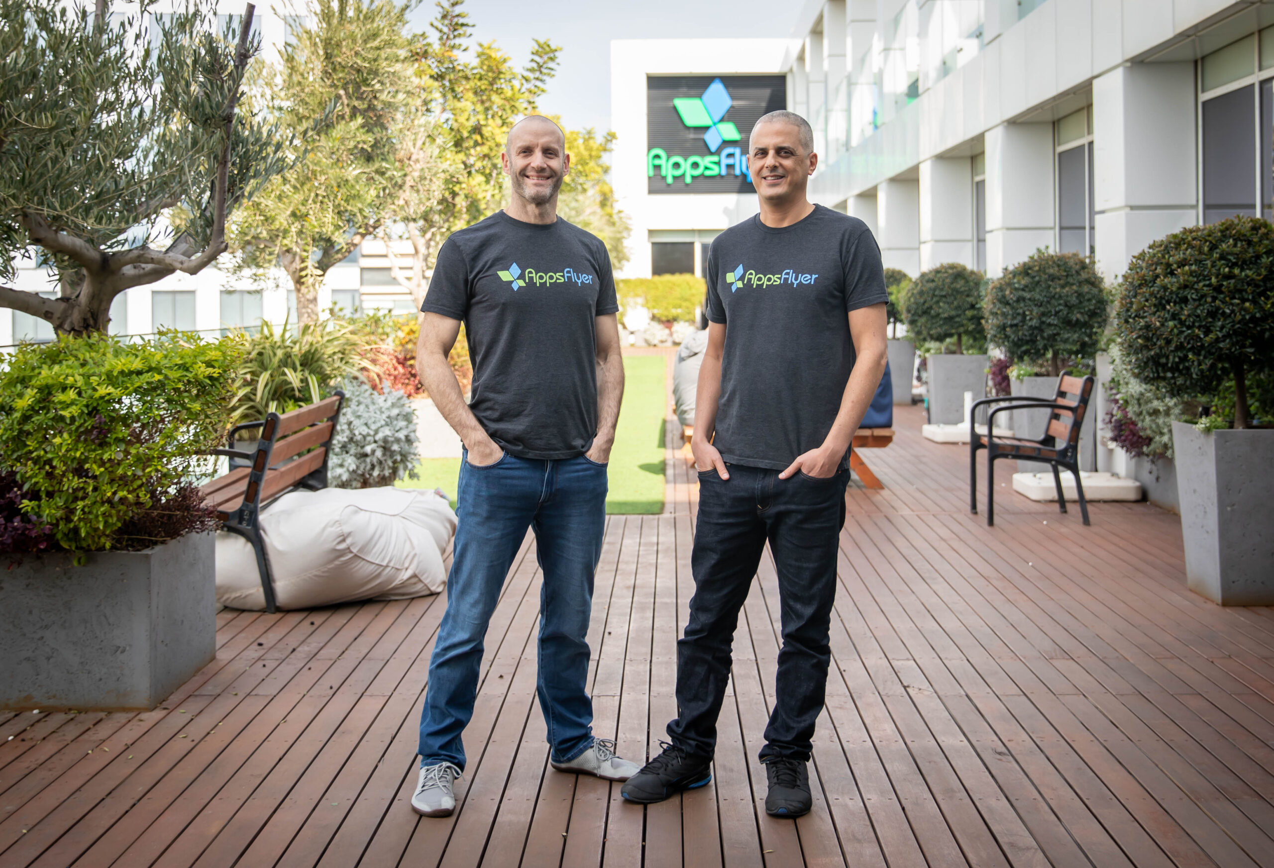 Reshef Mann, left, and Oren Kaniel standing outdoors at AppsFlyer