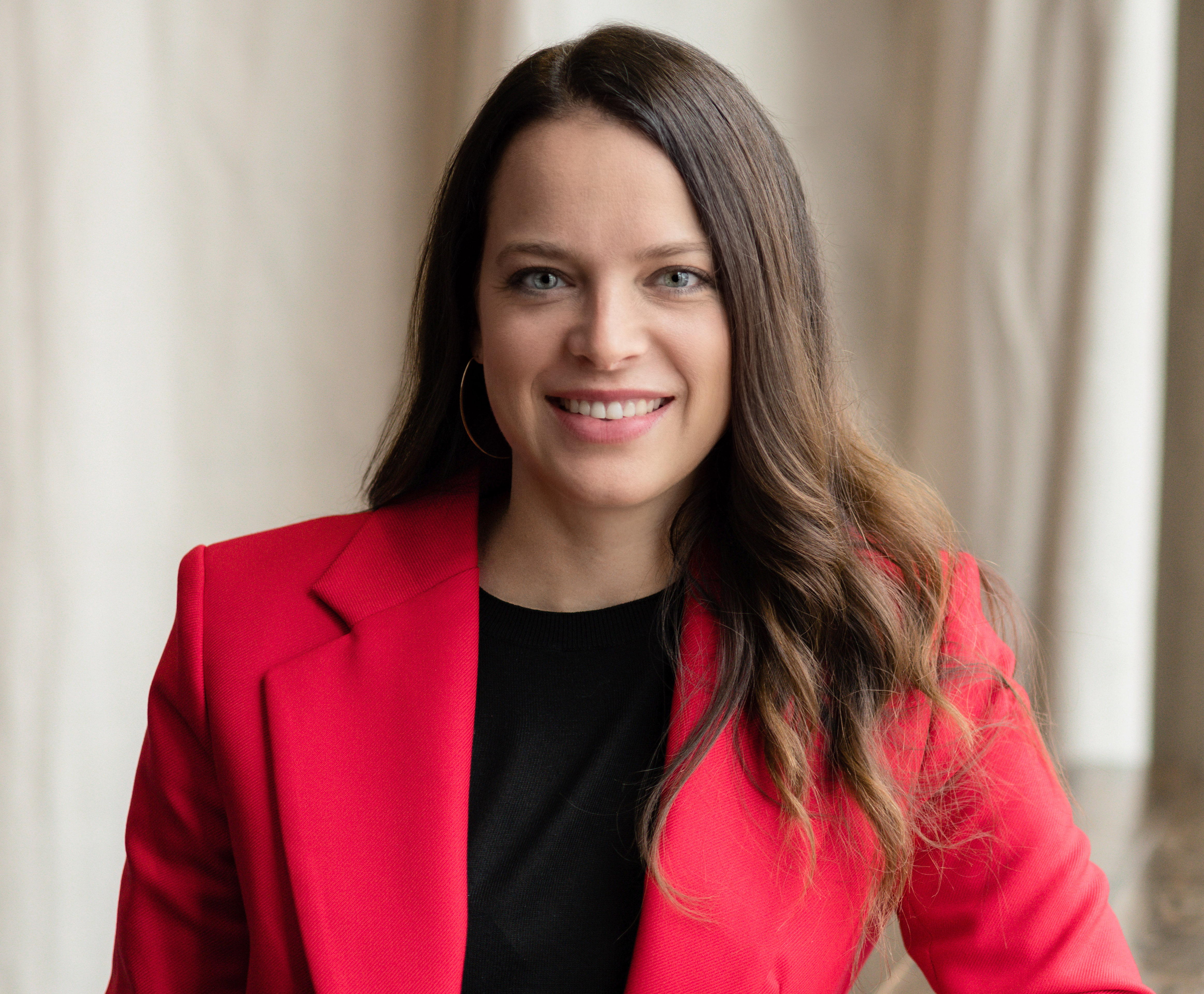 Resolute PR founder and CEO Nicole Morgan in a red blazer