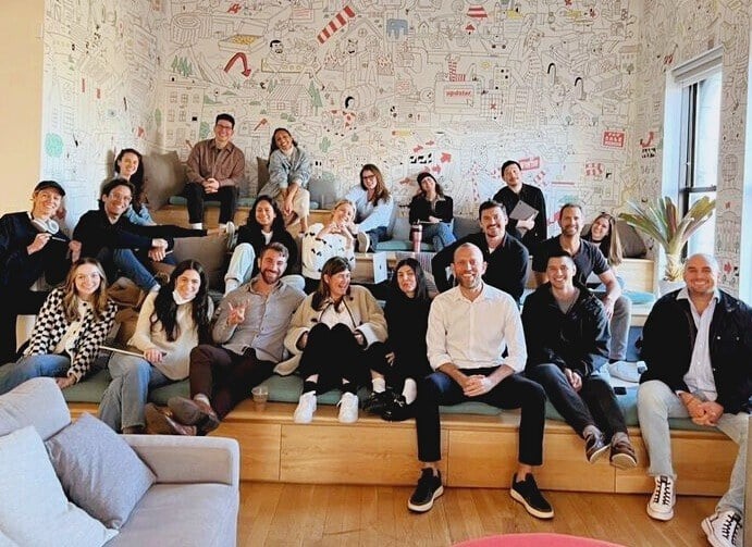 ResortPass team gathered together on tiered seating