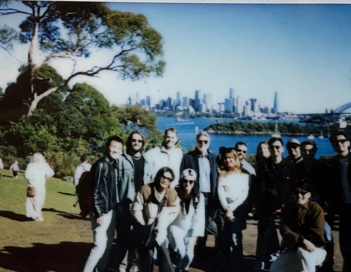 Respondent teammates gathered at a Sydney harbour lookout, with the city skyline behind them