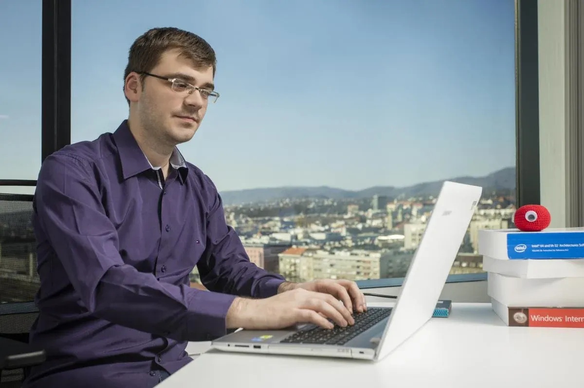 Tomislav Peričin working at a laptop in ReversingLabs’ Zagreb office