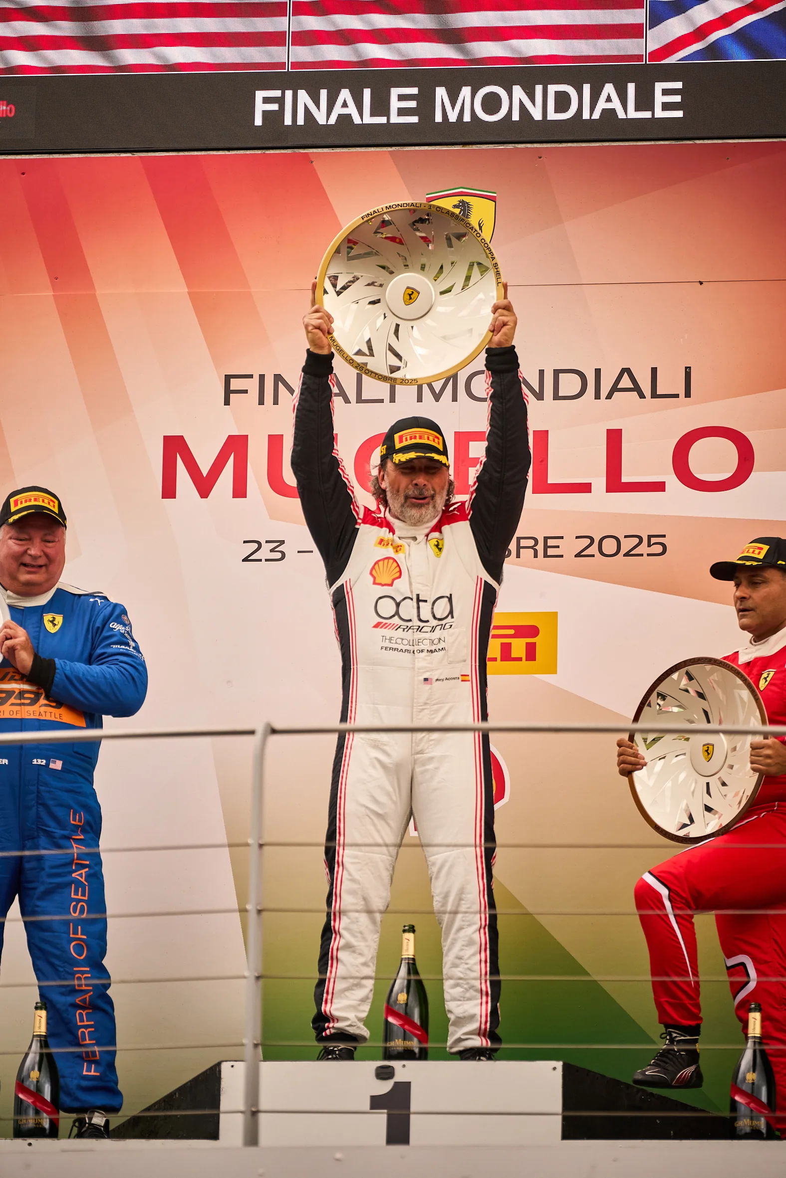 Rey Acosta raises his Coppa Shell trophy on the Mugello podium in October 2025