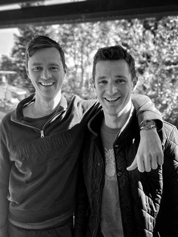 Rhys and Jordan Rogers together in a black-and-white photograph