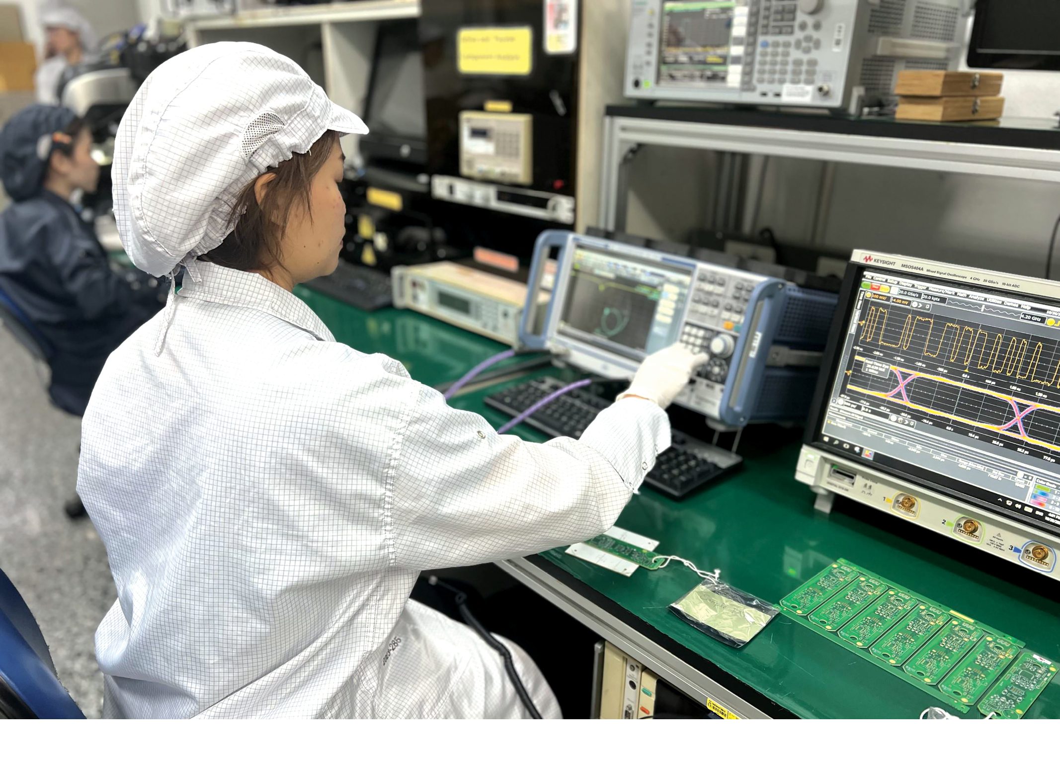 A Kimball Electronics employee testing circuit boards with electronic measurement equipment