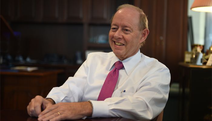Rich Holbrook seated at his desk during a 2016 interview.