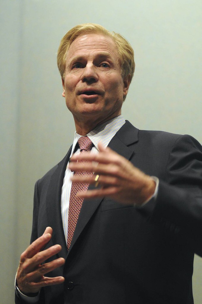 Richard Fairbank gesturing while addressing a Stanford Graduate School of Business audience