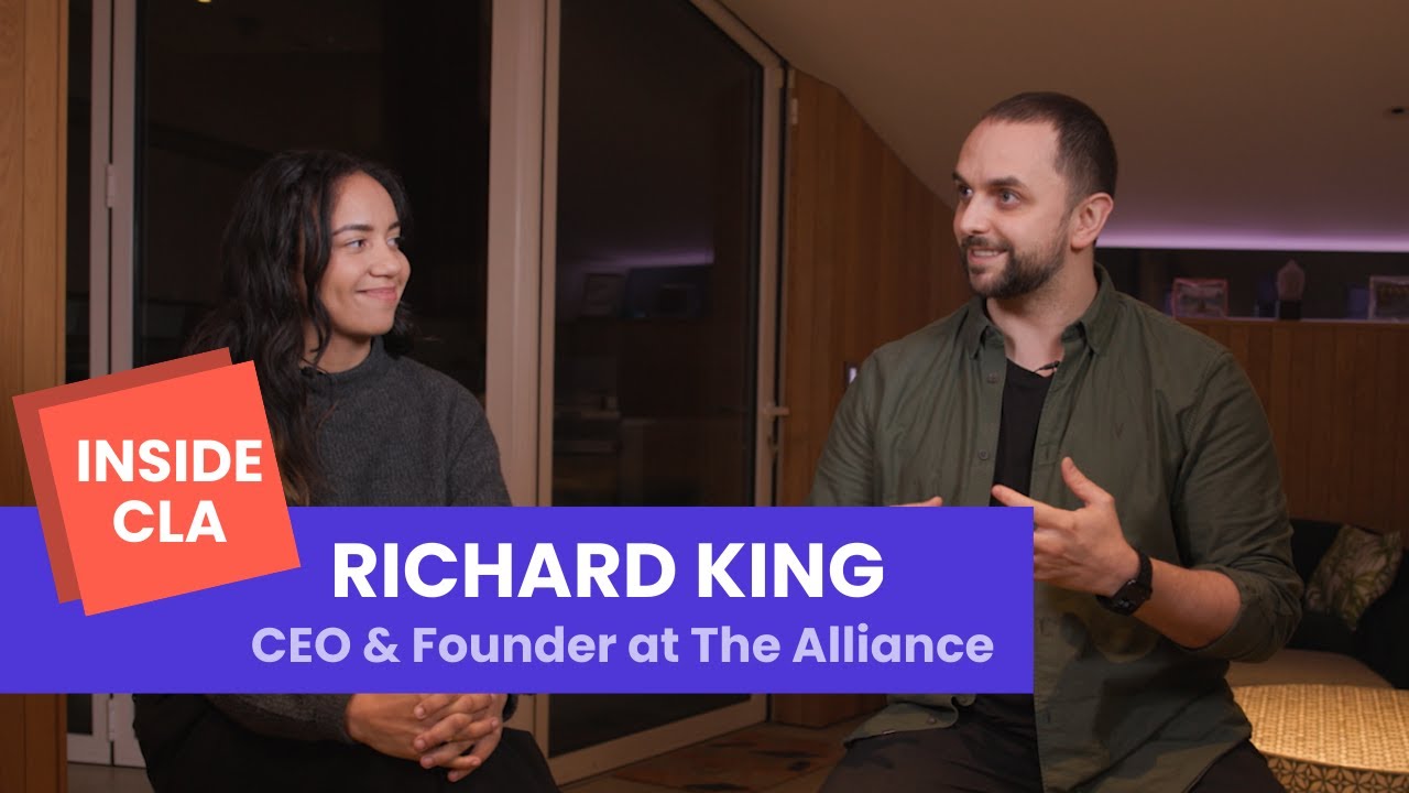 Richard King, seated at right, speaking with an interviewer for Inside CLA