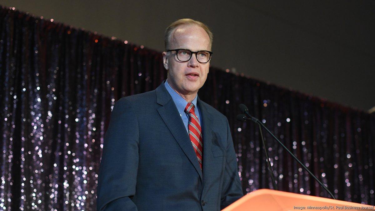 Richard Olson speaking at a podium during a Business Journal event
