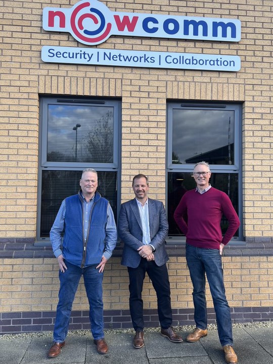 Richard Pennington, centre, with two colleagues outside the Nowcomm building