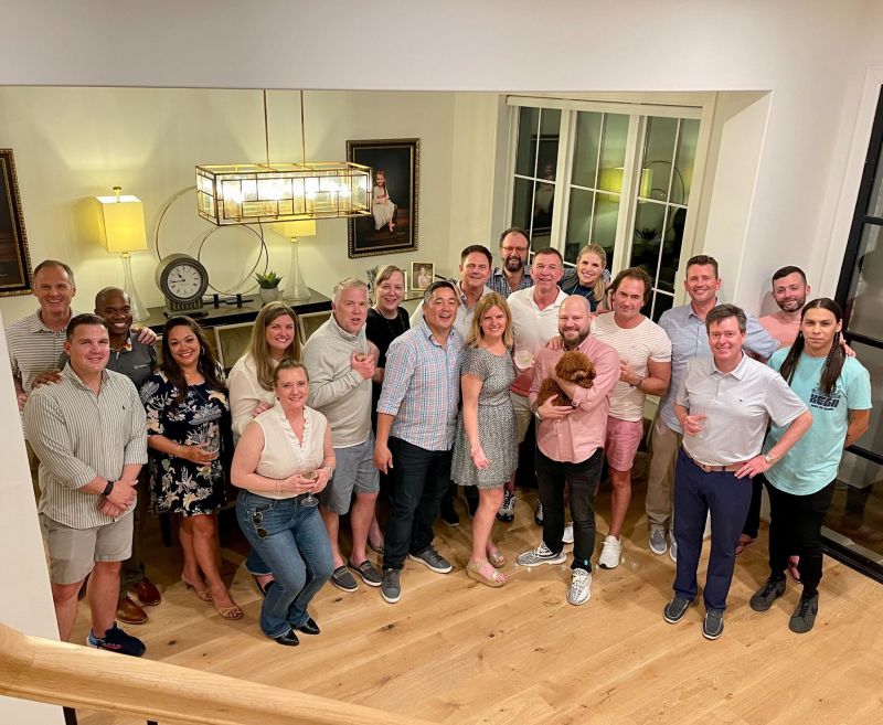 Empyrean colleagues gathered at Richard Wolfe’s home, in a photograph he shared in May 2022