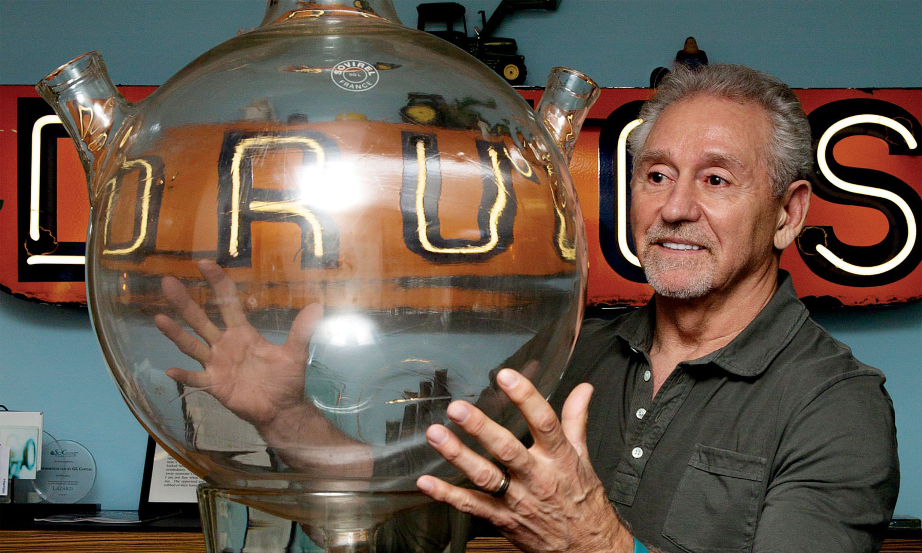 Rick Hawkins in his office with objects reflecting his background and career