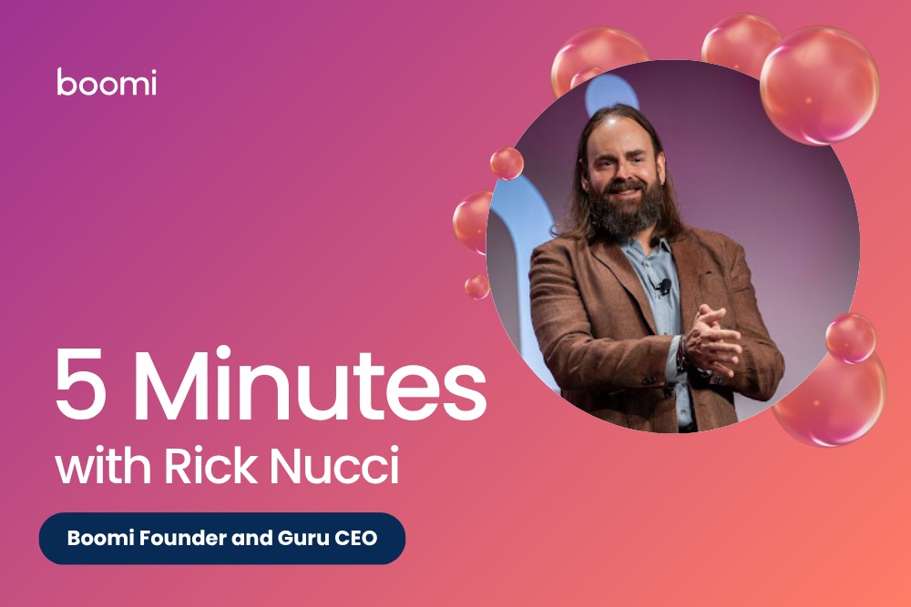 Rick Nucci smiling onstage in a Boomi interview graphic