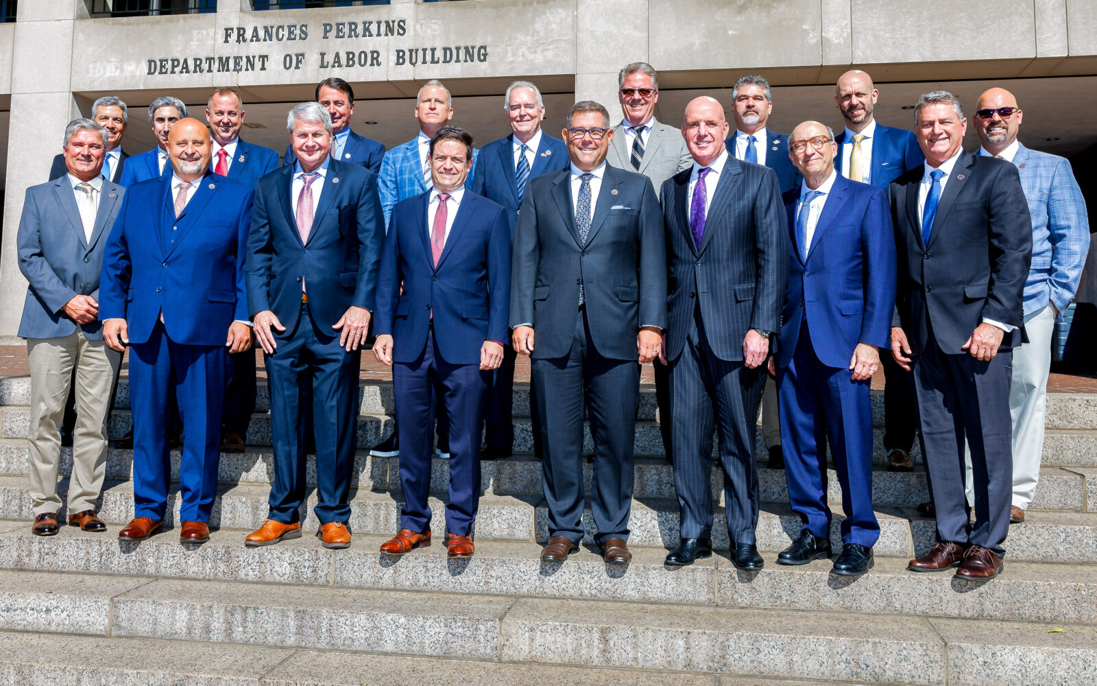 Electrical Transmission and Distribution Partnership representatives outside the Frances Perkins Department of Labor Building