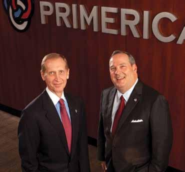 Rick Williams, left, and John Addison standing together beneath Primerica lettering