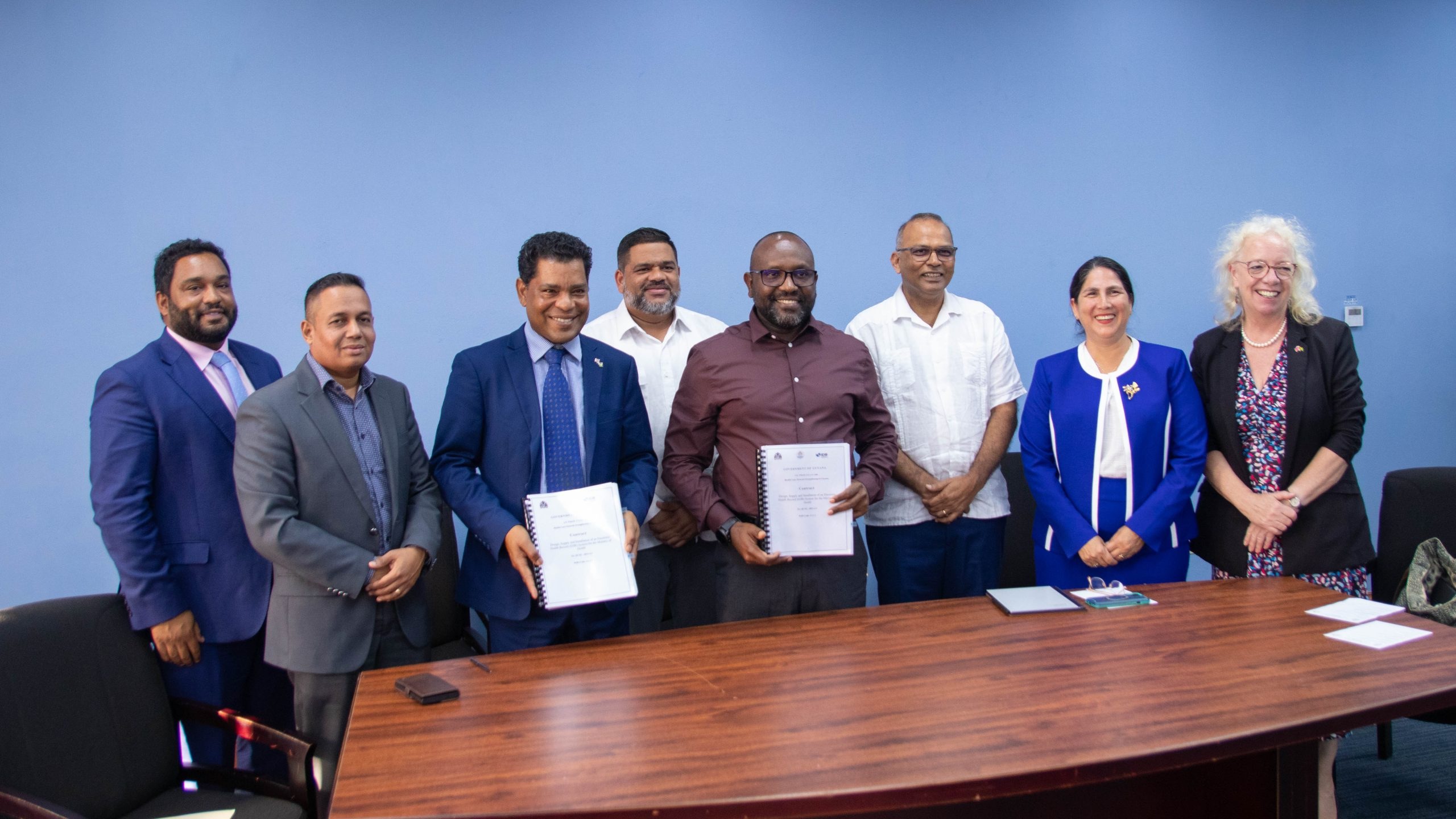 RioMed and Guyana health officials display documents at the March 2025 contract event