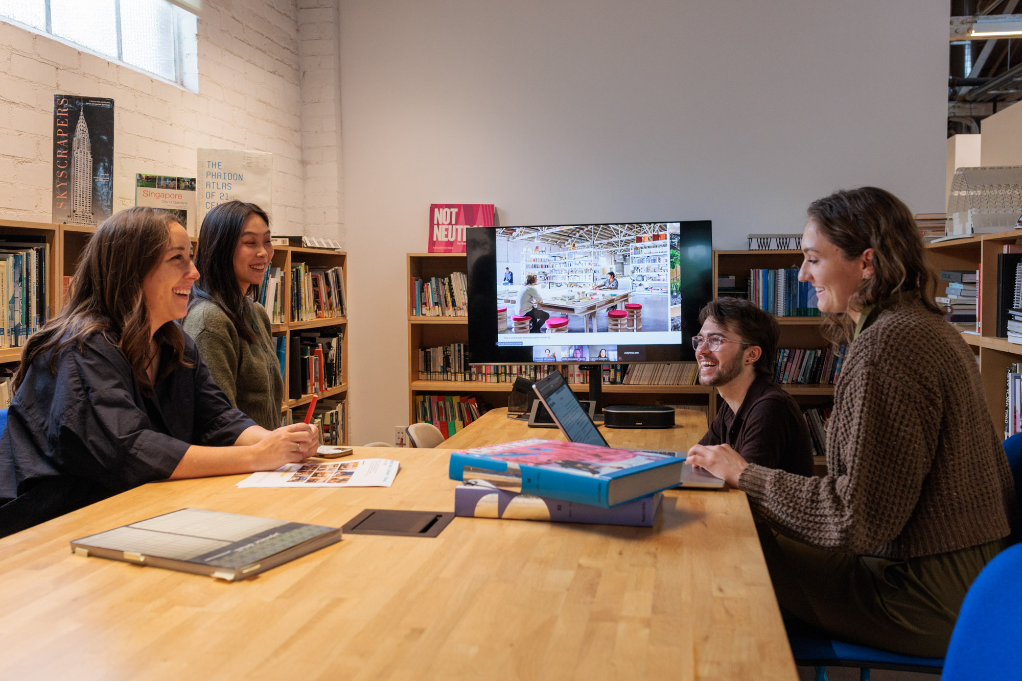 RIOS team members collaborating in the studio library