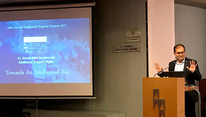 Ripal Vyas speaking at a lectern at the 10th Annual Intellectual Property Summit in 2017