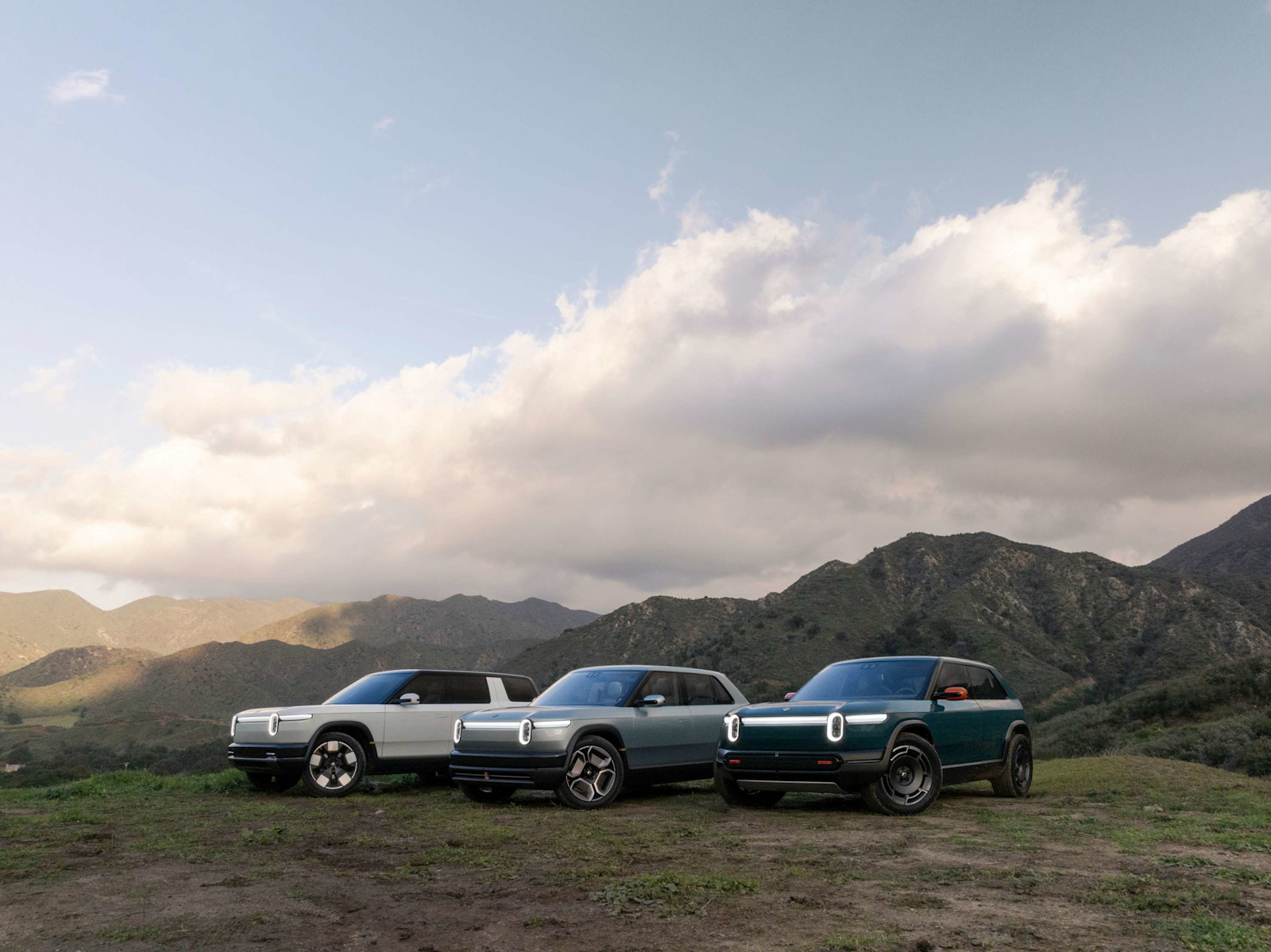 Rivian R2, R3 and R3X reveal vehicles on a hillside