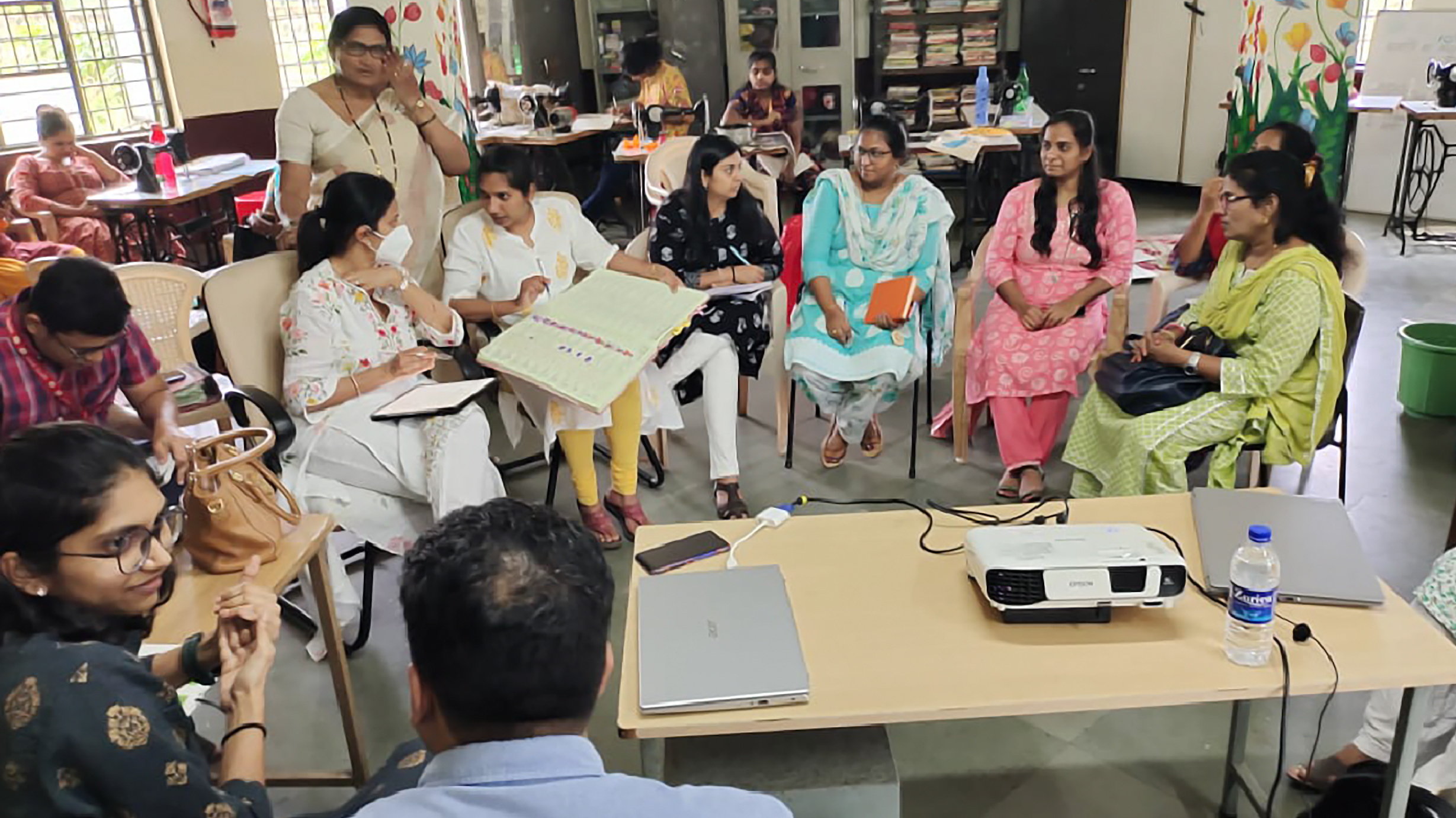 A group discussion around a table during foundation field work