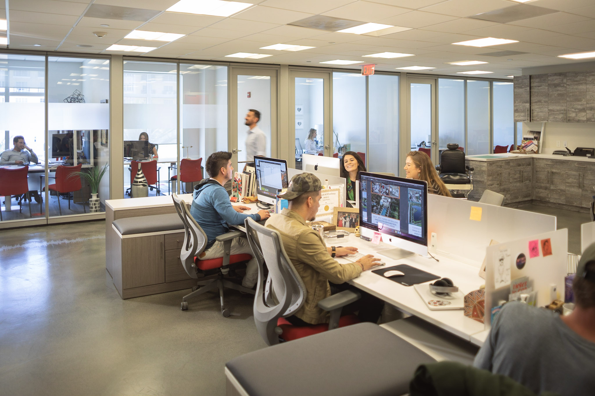 Roar Media team members working in an open-plan office