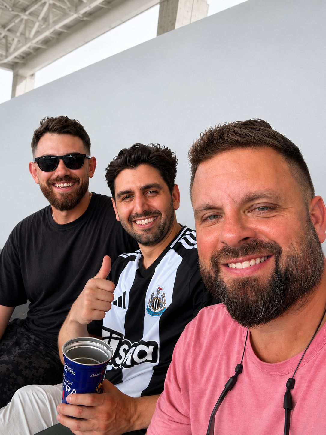 Rob Frechette with Rish Gupta and Walker Rice at a football match in Miami
