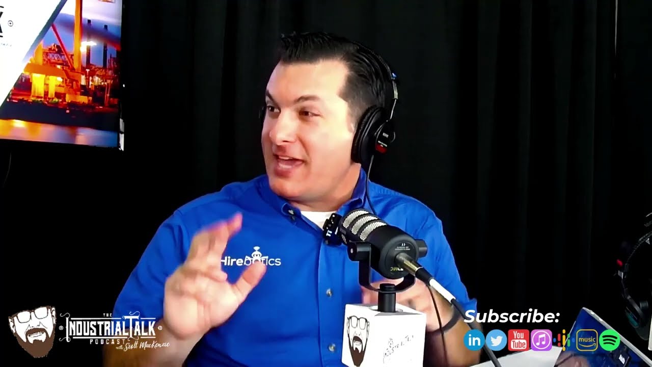 Rob Goldiez speaking into a microphone during his Industrial Talk interview at FABTECH
