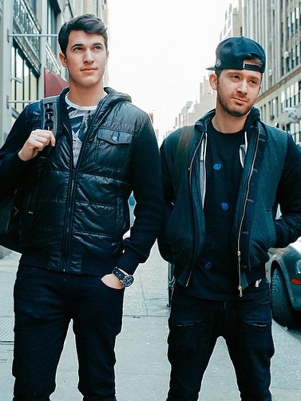 Cal Shapiro, left, and Rob Resnick, right, walking together on a city street