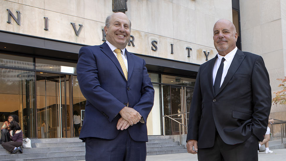 Pace University president Marvin Krislov, left, and Rob Sands, right, outside a university entrance