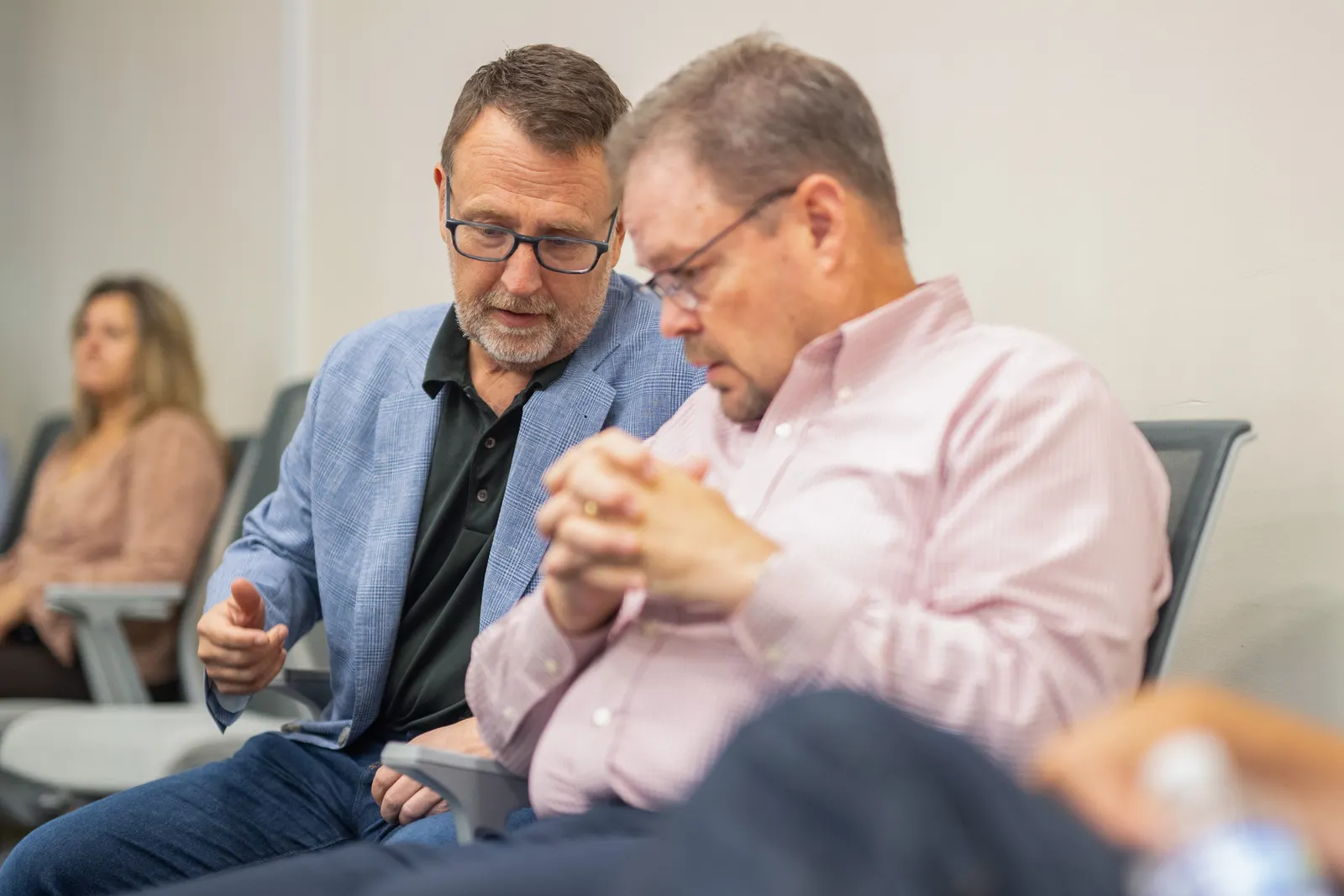 Rob Vitale speaking with chief information officer Mike Sullivan before a town hall