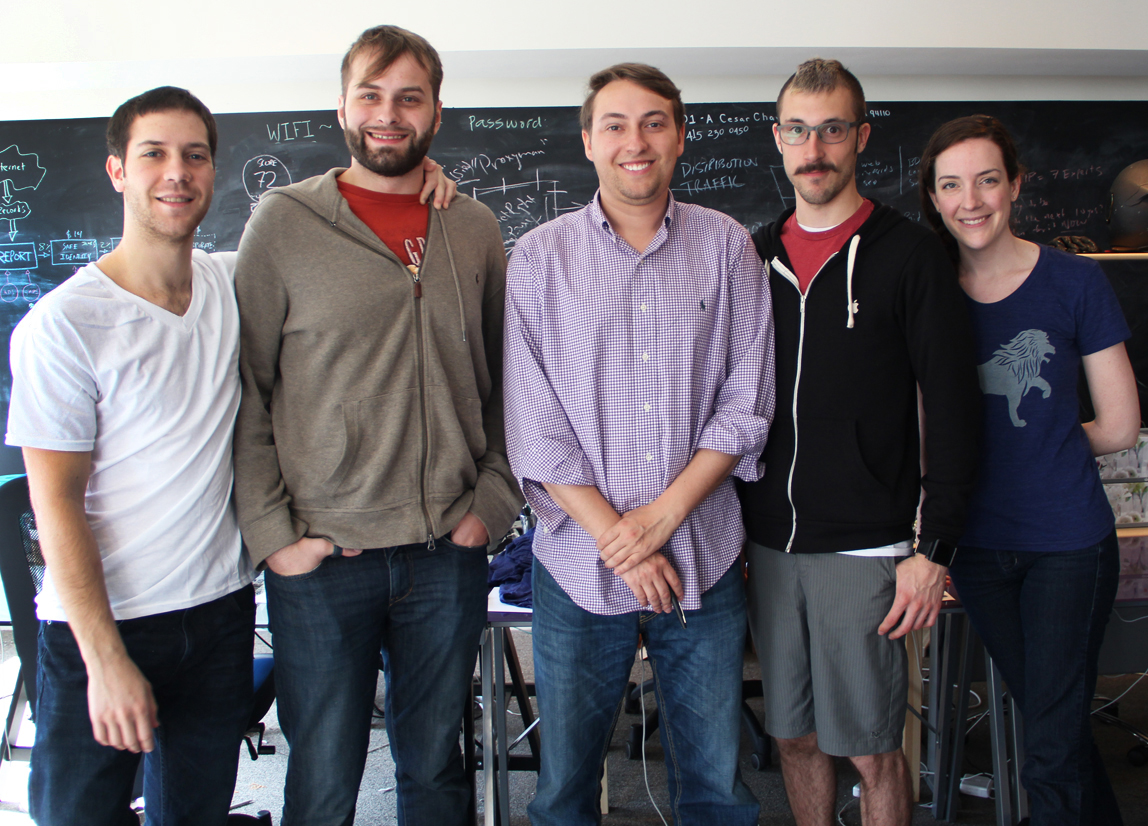 The five-member Safe Shepherd team standing together in front of a chalkboard