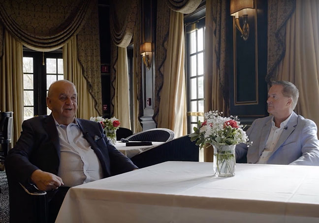 Robert Slack, left, and Dan Walters seated across a table