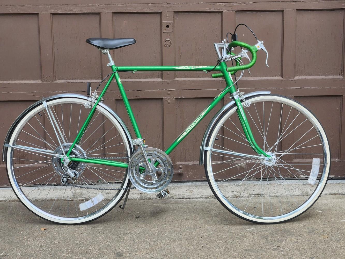 Todd Murphy’s green Schwinn ten-speed bicycle, photographed beside a garage