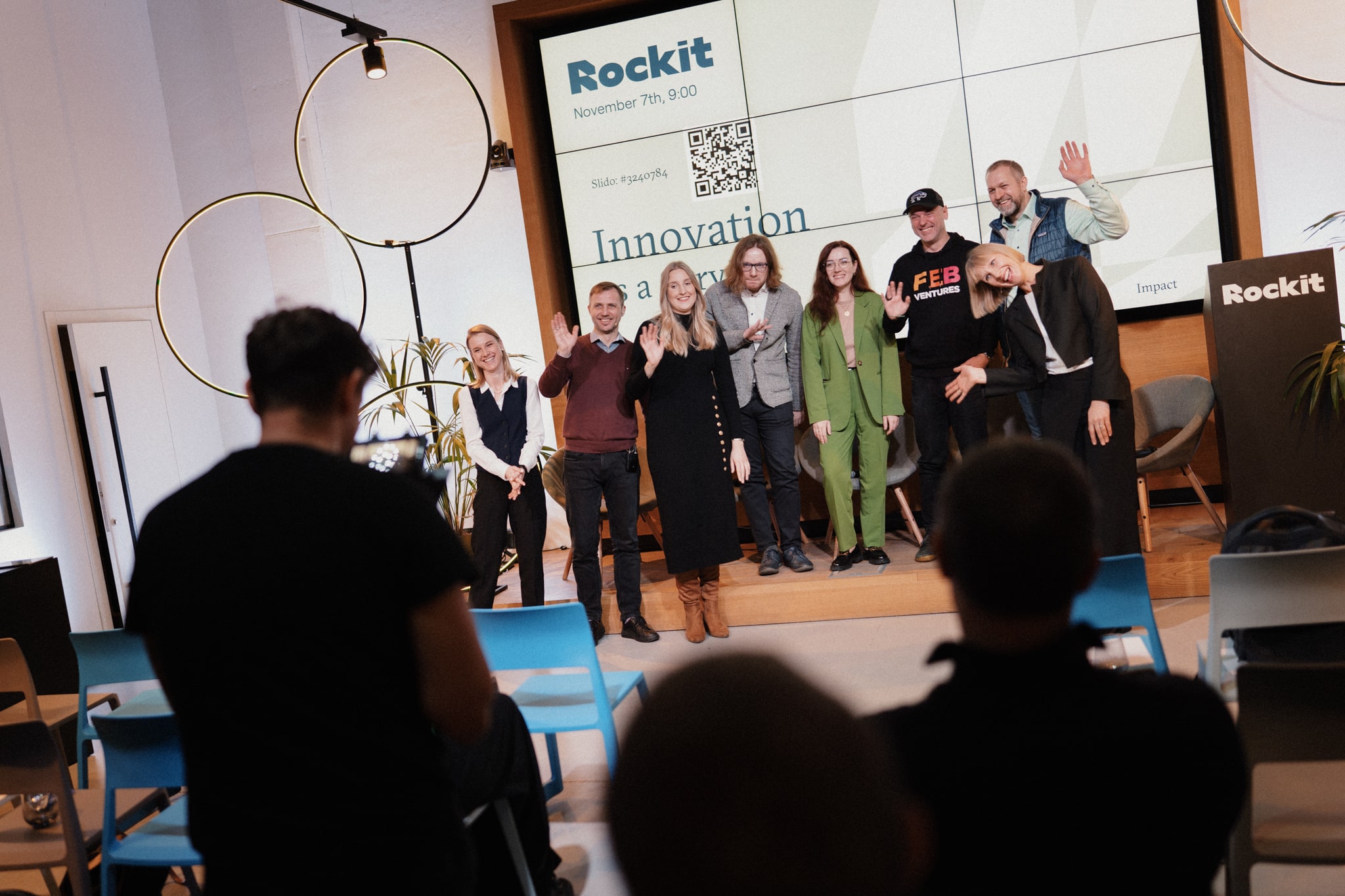 ROCKIT community members posing on a stage during an innovation event