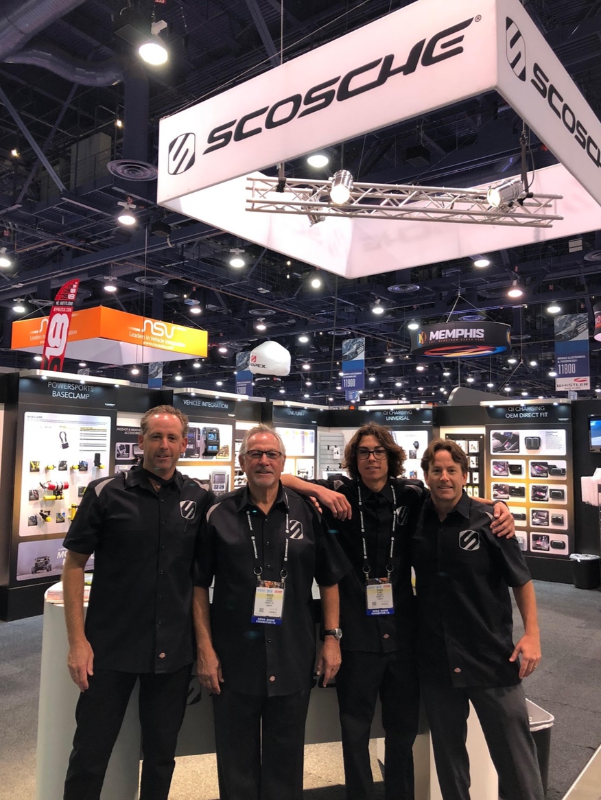 Kas, Roger, Ryder and Vince Alves standing together at Scosche’s booth during SEMA in 2018