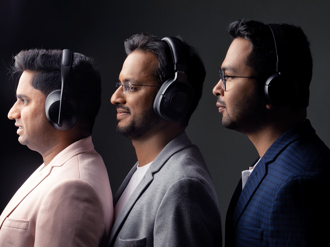 Pocket FM’s three co-founders wearing over-ear headphones in a studio portrait