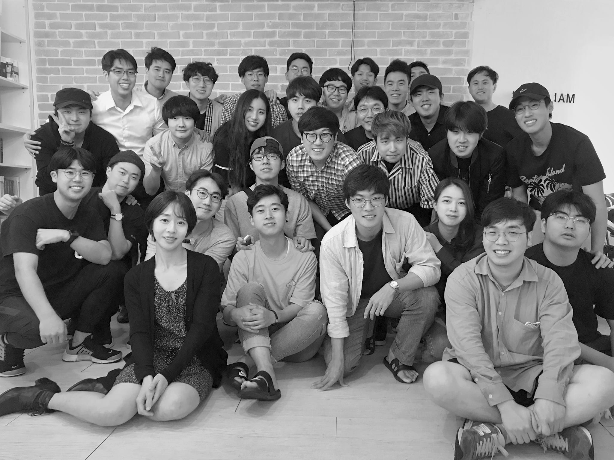 AB180 colleagues gathered for a black-and-white group photograph