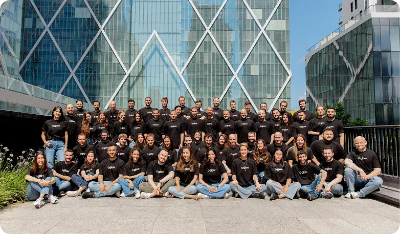 The Glow team gathered outdoors in matching black shirts