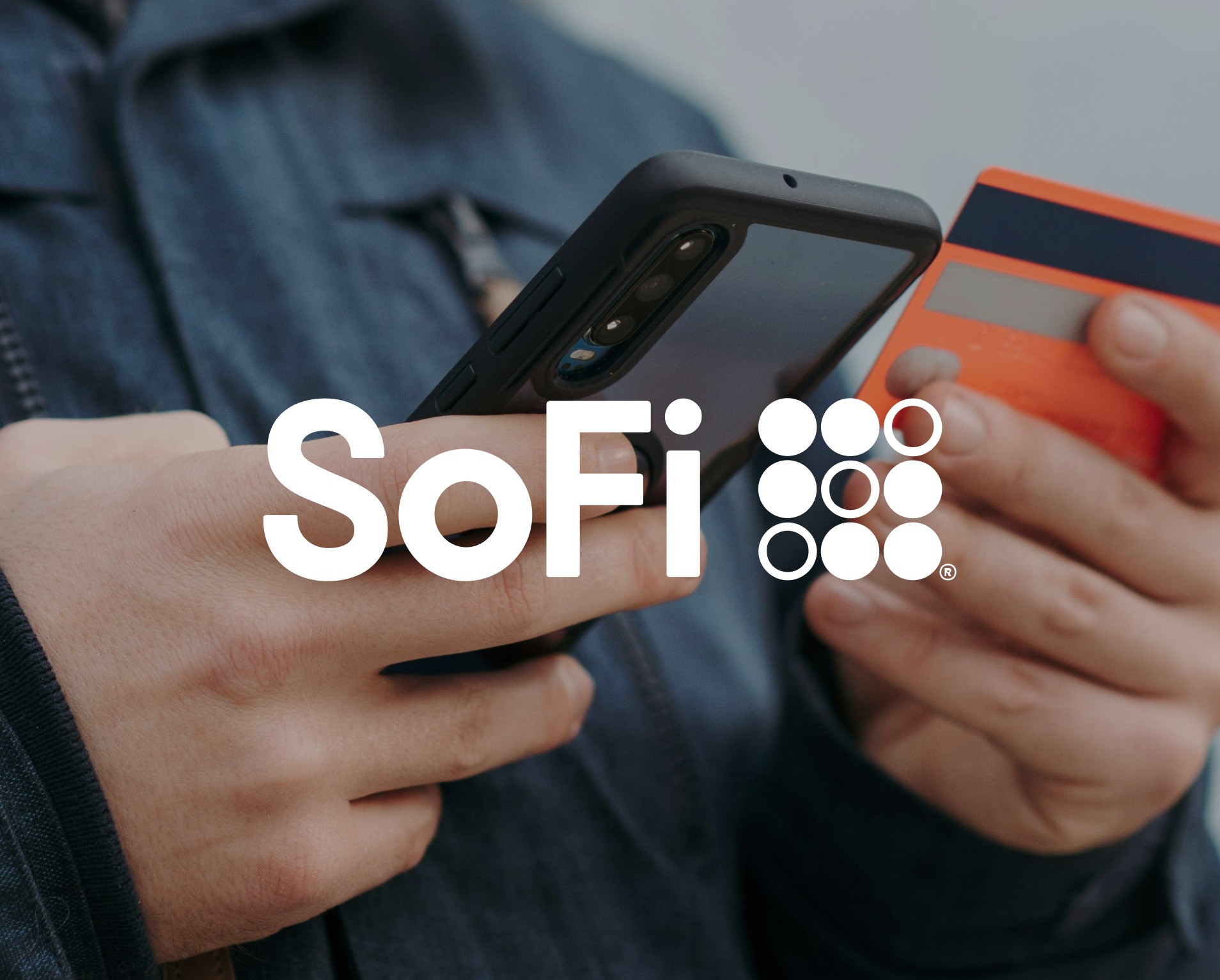 A person using a phone and payment card beneath the SoFi logo