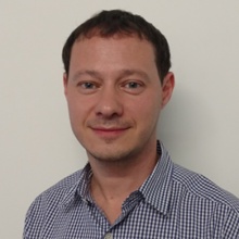 Roman Vintfeld in a checked shirt, in his AI Assist speaker photograph