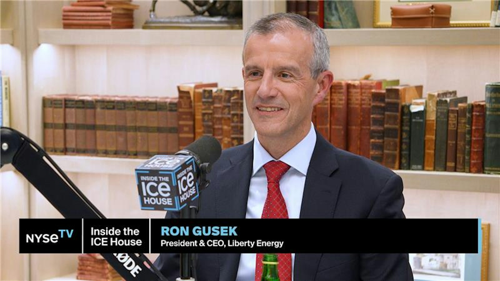 Ron Gusek speaking into an Inside the ICE House microphone during a NYSE TV interview
