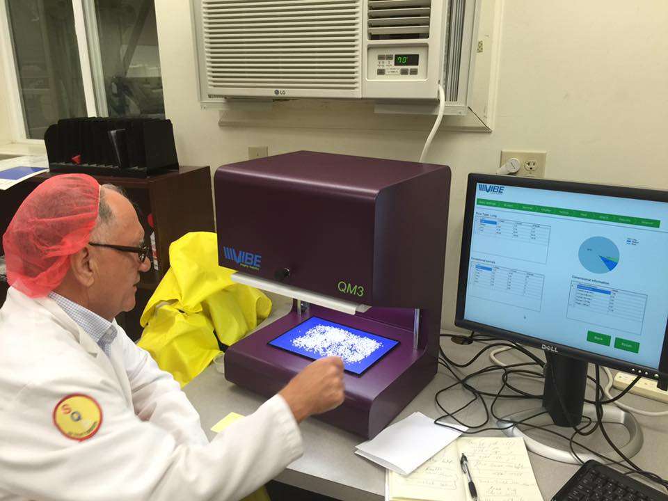 A Vibe QM3 analyzer and its reporting screen in use at a customer site