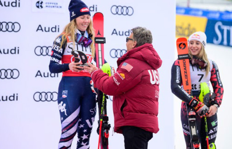 Ron Kruszewski presents Mikaela Shiffrin with her trophy at the 2025 Stifel Copper Cup.