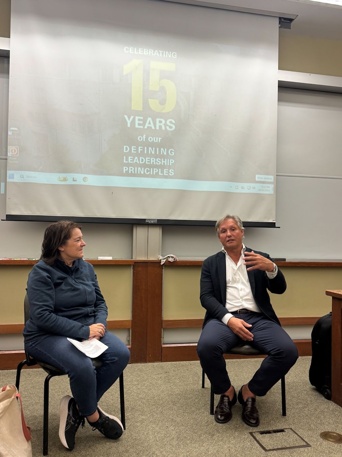 Ron Rudzin, seated at right, speaking during a Berkeley classroom discussion beside another participant